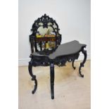 A reproduction black marble topped serpentine fronted console table on cabriole supports, width