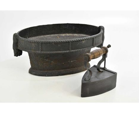 A modern cast iron oval planter, length 36cm, and a charcoal iron (2). 