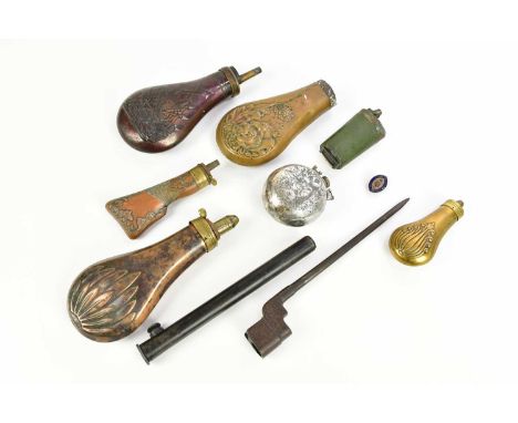 Seven 19th century and later copper, brass and metal powder flasks, one modelled as a gun butt, length 13cm, and another embo