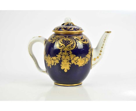 SÈVRES; an early 20th century cobalt blue teapot and cover with gilded detail, height 12cm.Condition Report: The cover and te