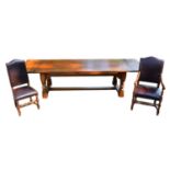 A good quality reproduction oak draw-leaf extending refectory dining table, with four plank top,
