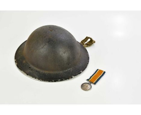 A WWI War Medal awarded to 6292 Pt F. Peat Royal Scots Fusiliers, and a WWII Civil Defence helmet (2) 