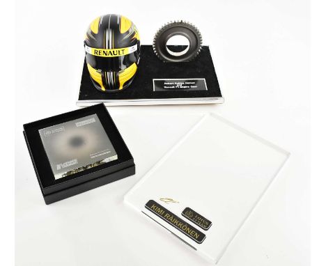 FORMULA ONE (F1) INTEREST; a Memento Robert Kubica miniature helmet and F1 engine gear on stand, and a Lotus F1 team Kimi Räi