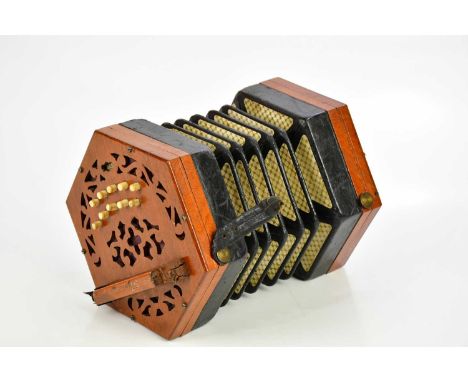 LACHENAL & CO; a 20th century twenty-one key concertina, with paper label, cased. 