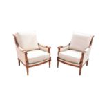 A pair of mahogany framed modern upholstered elbow chairs, height 85cm, width 60cm, depth 85cm.