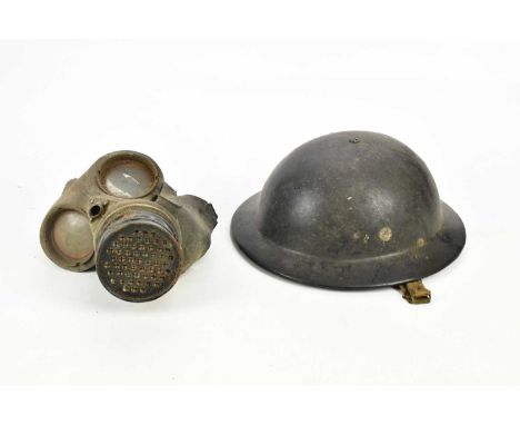 A WWII army helmet and gas mask.