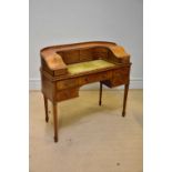 A reproduction mahogany and boxwood strung Carlton House desk of typical form, width 108cm.