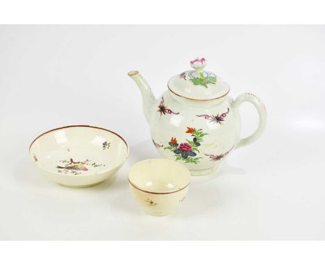 WORCESTER; an 18th century bullet shaped teapot, hand painted with floral sprays, with pseudo Kangxi mark to the underside, h