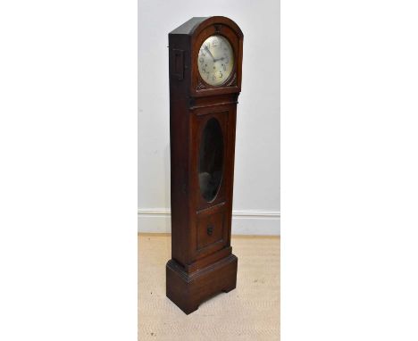 An early 20th century oak longcase clock of small proportions, with silvered dial set with Arabic numerals above the glazed d