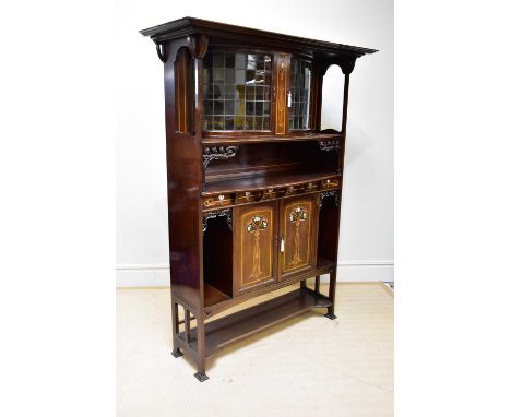 A Scottish Arts and Crafts inlaid mahogany display cabinet, with moulded cornice above a central inlaid panel flanked by a pa