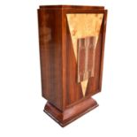An art deco style mahogany and rosewood veneer revolving drinks cabinet with fitted interior, height