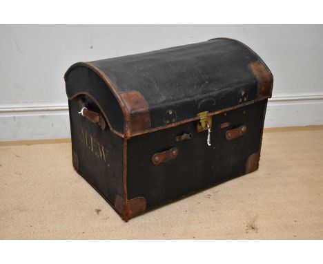 An early 20th century leather bound dome topped trunk, length 76cm.