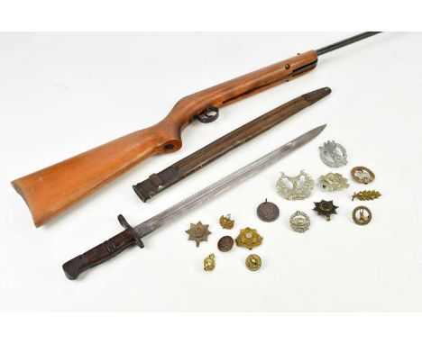 BSA; a Cadet .177 break barrel air rifle with case, a WWI period US Army P17 bayonet with scabbard and a collection of cap ba