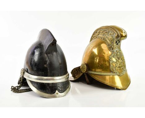 A Victorian Merryweather fireman's brass helmet with applied plaque, and a leather fireman's helmet (2).   Condition Report: 