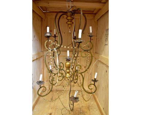 A decorative Italian style eleven branch ceiling light with gilt wood central column, height 132cm.Condition Report: The item