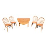 ERCOL; a Windsor gateleg table, height 72cm, length 106cm, width 22cm, together with a set of four