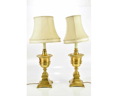 A pair of modern good quality brass table lamps modelled as urns, on stepped plinth bases, height including fitting 54cm (2)C