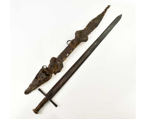 A late 19th century Sudanese Mahdist kaskara sword in crocodile scabbard and with Islamic script to blade, length of blade 90