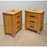A pair of modern light oak three drawer chests on block feet, height 91cm, width 74cm, depth 47cm (