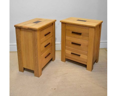 A pair of modern light oak three drawer chests on block feet, height 91cm, width 74cm, depth 47cm (2). 