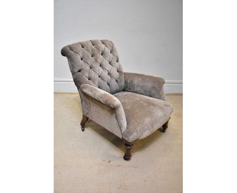 A 19th century upholstered button back armchair, on turned front supports, height 83cm.Condition Report: No rips to the uphol