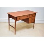 A mid century teak desk, with an arrangement of four drawers, on tapered circular legs, height 77cm,