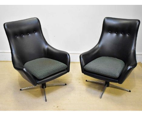 A pair of 1970s swivel office chairs, with button backs and cast metal bases, height 96cm (2).