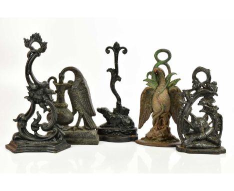 Five Victorian and later cast iron doorstops including a hunting example with central fox head resting on hunting boot, heigh