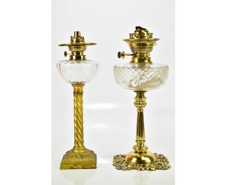 Two brass oil lamps, comprising a gilt brass example with spiral column, the other with a pierced base, tallest 40cm (2)Condi