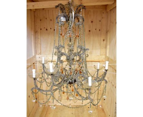 A large and impressive ceiling light with applied glass trailing detail and droplets, with glass drip trays, height 120cm.Con