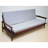 GUY ROGERS; a teak day bed/settee on column supports, width 197cm. Condition Report: Wear and