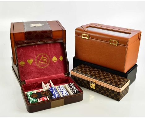 AB COLLECTION; two electric automatic leather watch cases, a further watch box, and a boxed poker set with chips.