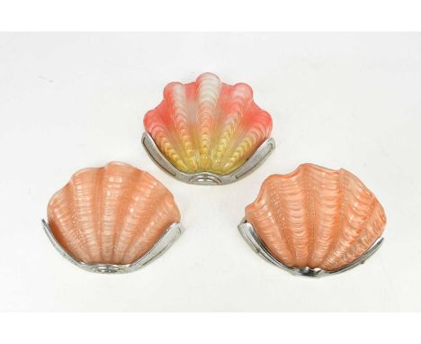 Three Art Deco wall lights with chrome fittings and shell shaped glass shades, height 20cm, width 26cm (3).Condition Report: 