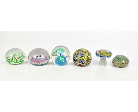 STOURBRIDGE; a late 19th century millefiori paperweight, diameter 9cm, and five further paperweights, one example modelled as