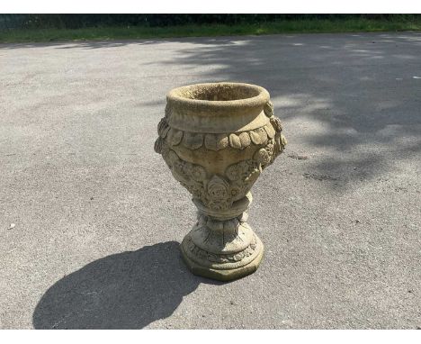 A modern reconstituted relief decorated stone planter on stand, height 64cm.