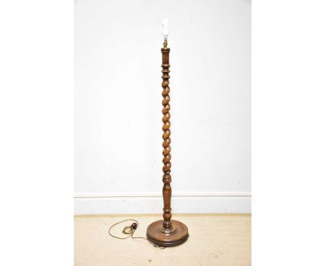 An early 20th century oak barley twist standard lamp, 174cm.Condition Report: The item or items in this lot are sold as decor