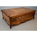 A modern rectangular coffee table with pull-up sections, on block legs, length 122cm, depth 90cm,