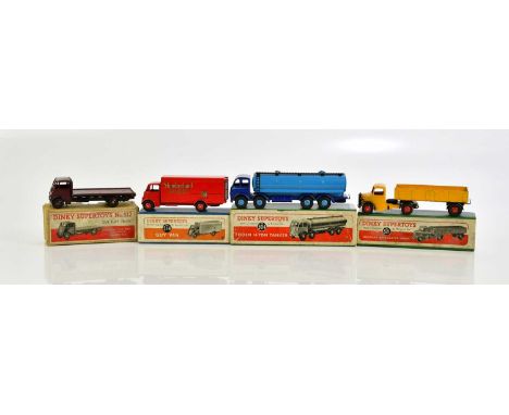 DINKY SUPERTOYS; four boxed models comprising 512 Guy Flat Truck, 504 Foden 14-Ton Tanker, 521 Bedford Articulated Lorry and 