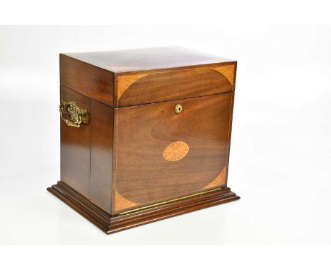An Edwardian inlaid mahogany Sheraton Revival decanter box, the hinged cover and pull-down front enclosing gilt metal trays, 