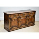 TITCHMARSH & GOODWIN; an oak dresser base with three drawers above three doors, width 169cm.