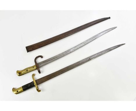 A French 1866 chassepot bayonet with scabbard and an 1855 Lancaster bayonet, length 74cm (2).