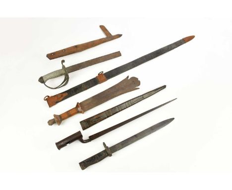 A Brown Bess type bayonet with leather scabbard, length 55cm, with another bayonet, a tribal type knife, a sword hilt with br
