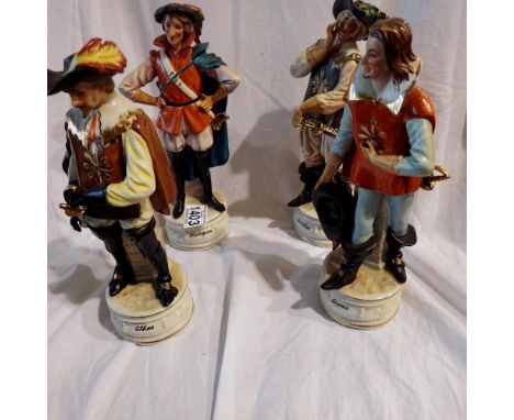 Three Musketeers and another ceramic figurines, H: 26 cm. Not available for in-house P&amp;P