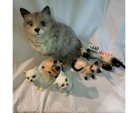 Four Beswick cat figures and two Goebel cats. Not available for in-house P&amp;P 