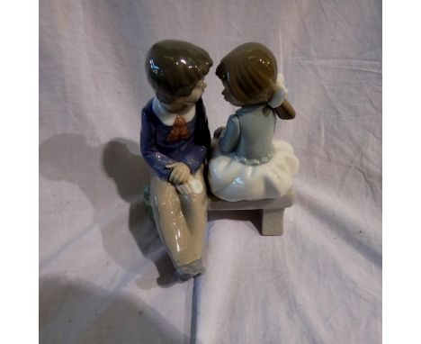 Nao figurine, two children on a bench. UK P&amp;P Group 2 (£20+VAT for the first lot and £4+VAT for subsequent lots)