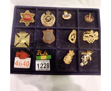 Twelve military medals and cap badges. UK P&amp;P Group 1 (£16+VAT for the first lot and £2+VAT for subsequent lots) 