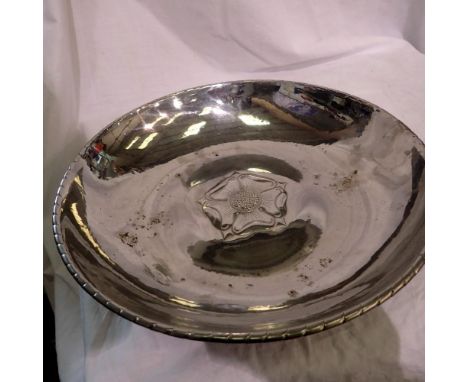 Keswick School of Industrial Arts circular polished steel Alms dish, with relief rose and plannished design, KSIA mark and nu