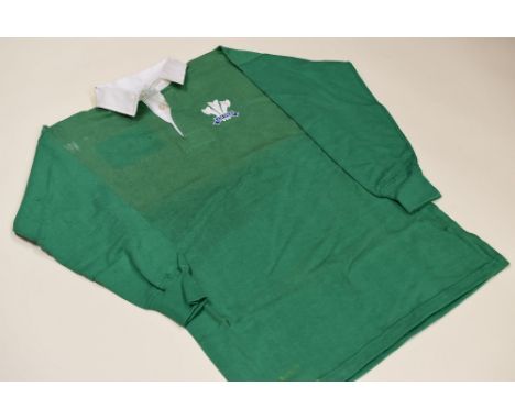 VINTAGE  WALES RUGBY UNION INTERNATIONAL GREEN JERSEY, CIRCA 1980s, non-numbered, complete with stitched crest and Umbro labe
