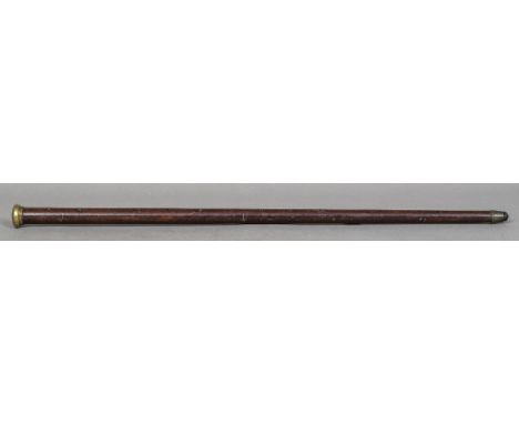 An unusual Chinese hardwood walking stick combination measuring stickThe gilt metal pommel above the main shaft with pique in