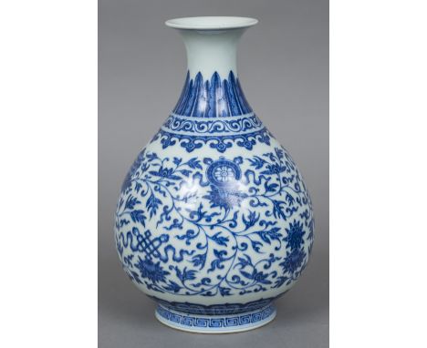 A Chinese blue and white porcelain baluster vaseAllover painted with lotus strapwork and lappet bands, blue painted six chara